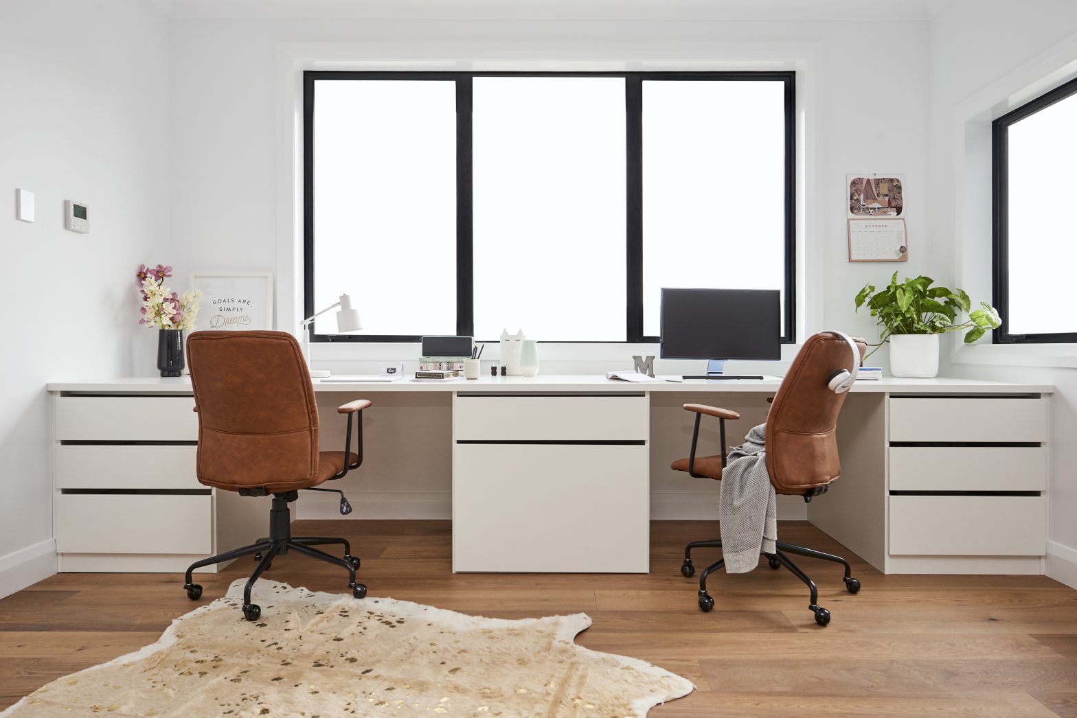 Give Your Office a Makeover an image of a desk with two workspaces